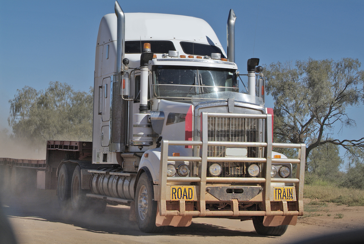 semi truck Large truck driving on dusty road